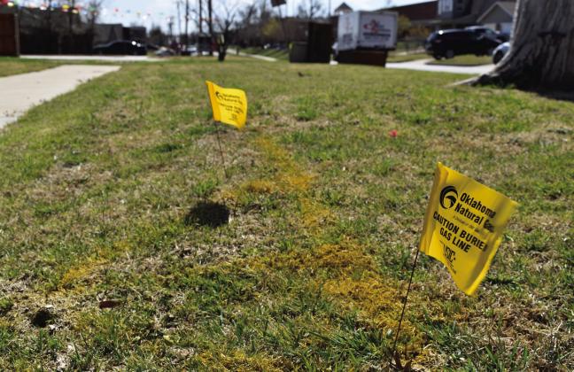 Buried natural gas pipeline markers are shown in Oklahoma City on Tuesday, March 12, 2024. Photo by Paul Monies/Oklahoma Watch