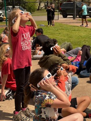 These Pauls Valley Intermediate School students had the opportunity to don their eclipse glasses and watch with their classmates from the school’s playground. 