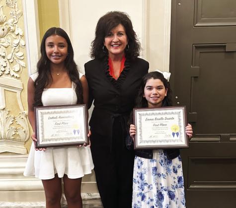 Pauls Valley students Ledesli Armendariz (left) and Brielle Duarte (right), pictured here with State Representative Tammy Townley, were among the Oklahoma Bar Association’s 2024 Law Day Art and Writing Contest winners recognized during a ceremony at the State Capitol April 4. Armendariz won first place in the ninth-grade writing contest, and Duarte won first place in the third-grade art contest.